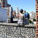 Illustration for article titled Womens bodies blend into a citys background with just bodypaint